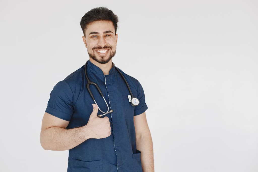 Smiling doctor giving a thumbs up